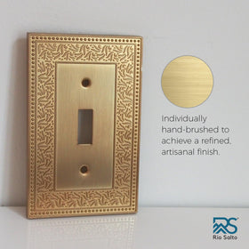 Decorative Laurel panel on wall highlights classic hardware details
