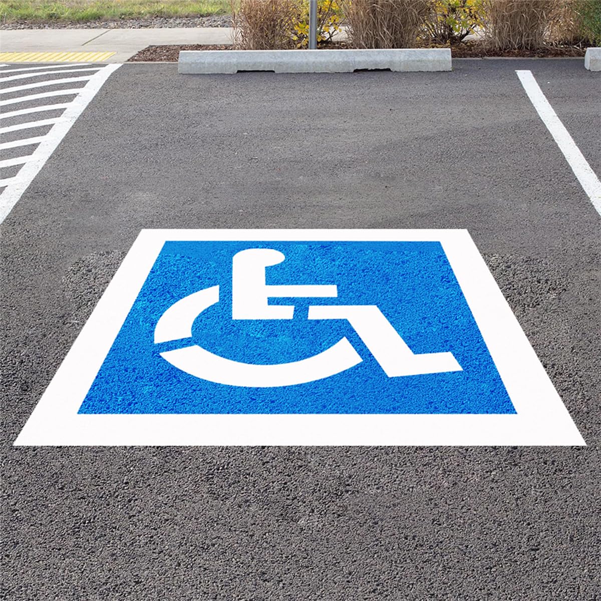RoadAlchemist handicap stencil on asphalt shows a clear 36x36 symbol for accessible parking.