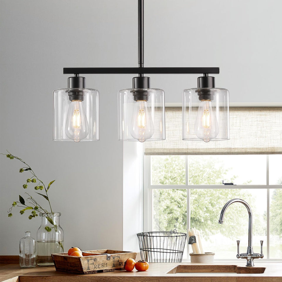 ROCUNSI 3-light kitchen island pendant in black with clear glass shades for versatile dining illumination.
