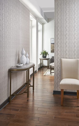 Roman PRO-555 Extreme Tack tan adhesive on wall illustrates durable bonding for long-lasting results.