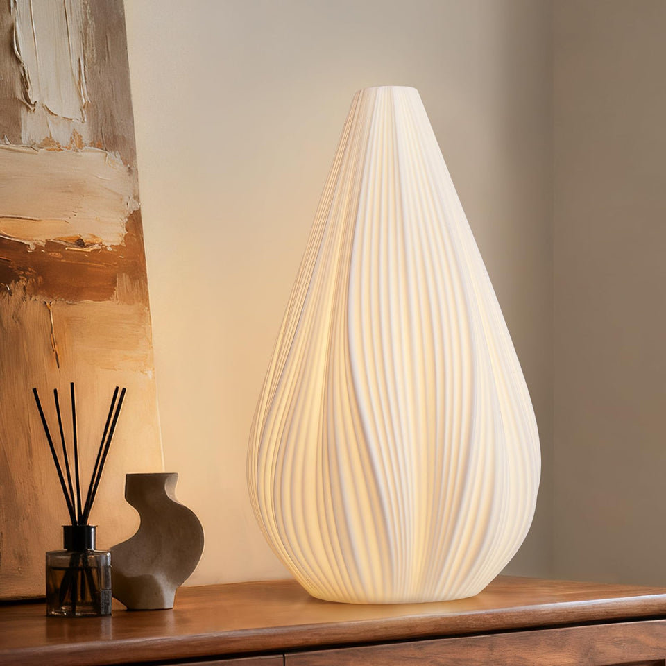 RONDURE 12.5-inch modern ceramic table lamp with shade emits warm translucent glow.