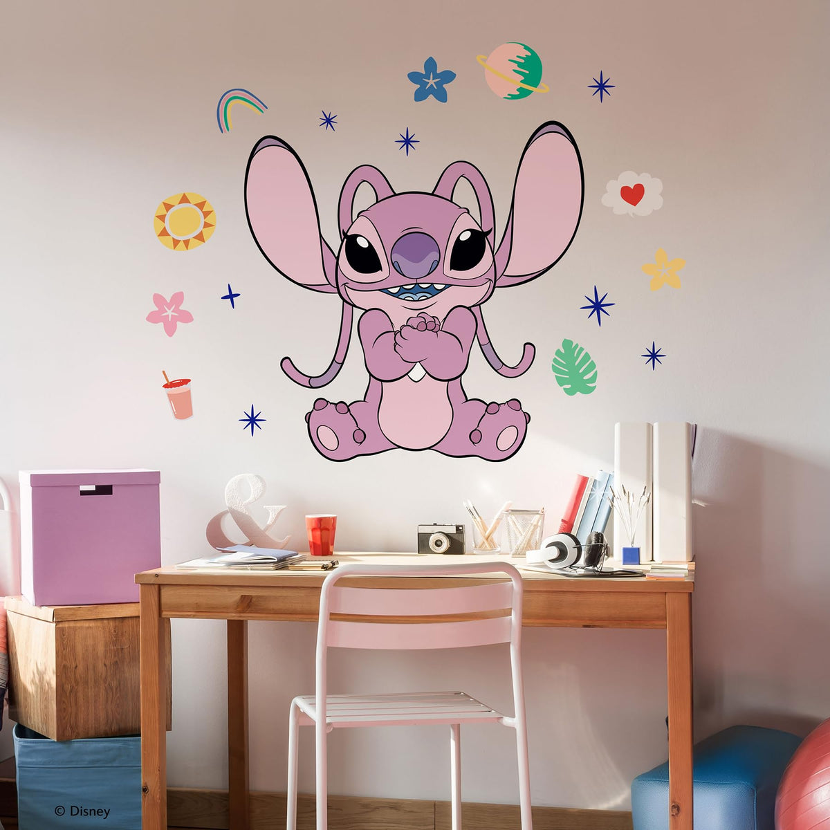 RoomMates Angel in a stellar pose wall decal adds a playful focal point for kids' rooms.