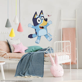 RoomMates Bluey peel and stick decal assembled to a 35.4 by 25.73 inch wall scene.