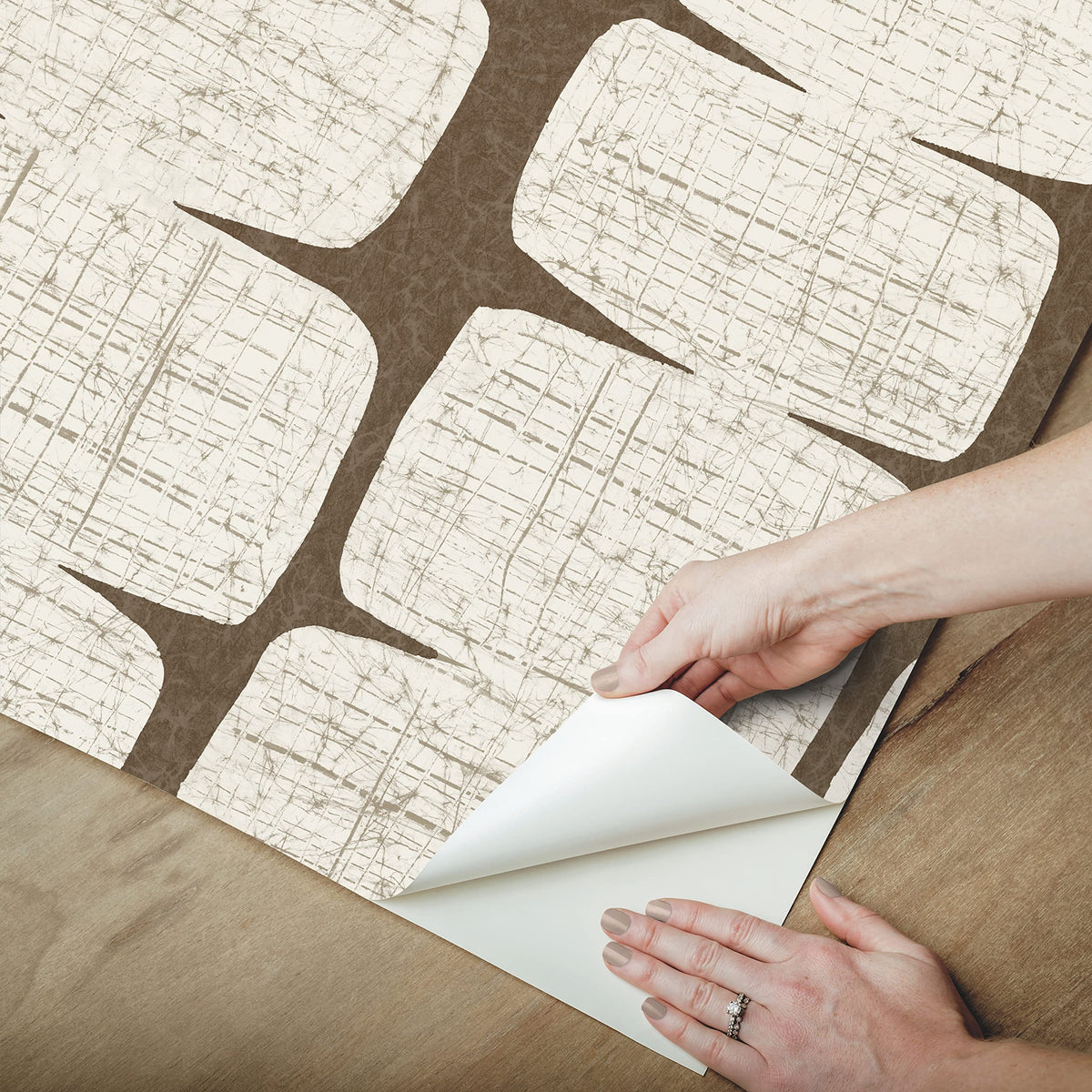 RoomMates RMK12349PL beads wallpaper wall application close-up with smooth surface adhesion.