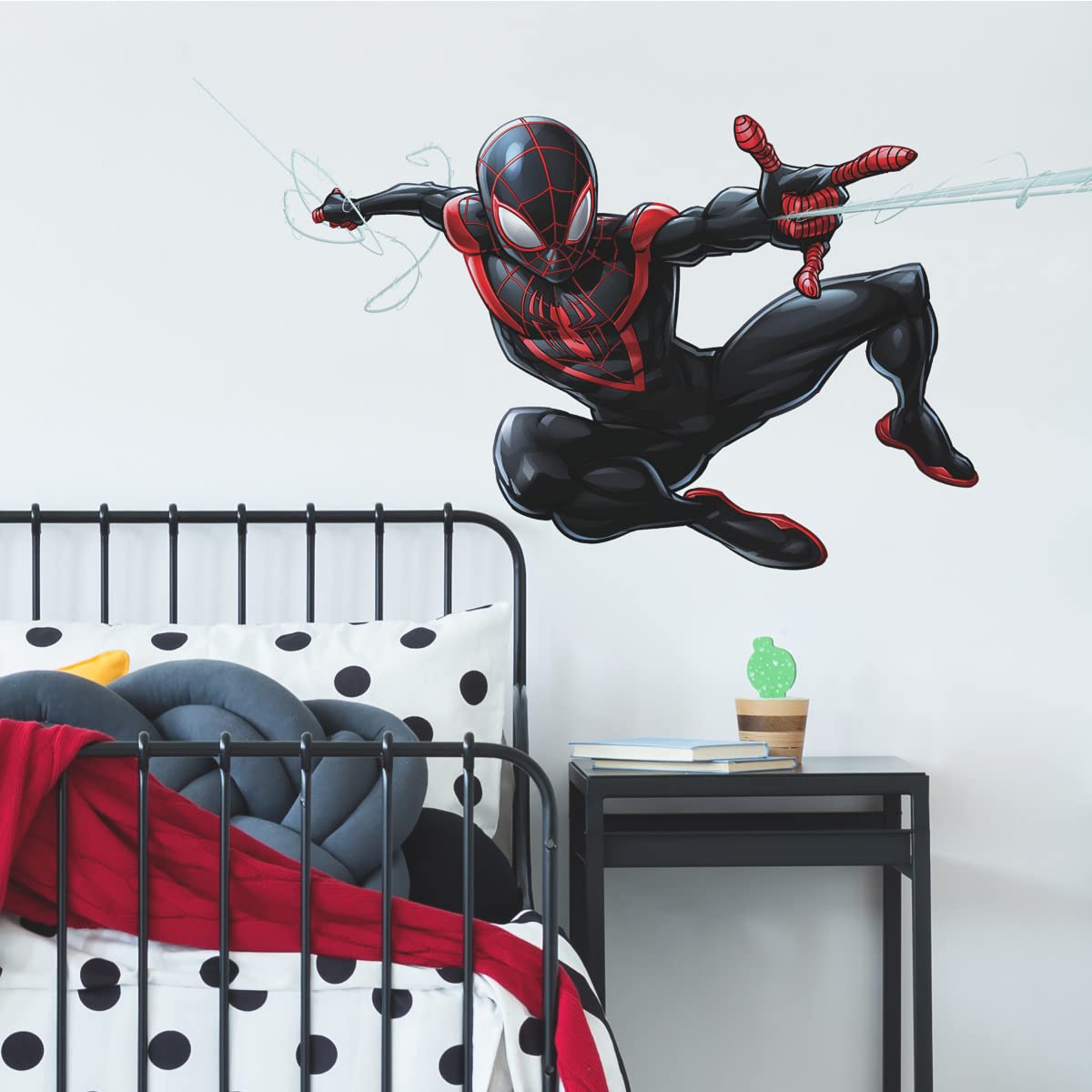 RoomMates Spider-Man Miles Morales decal application demonstrates quick peel-and-stick setup on smooth surfaces