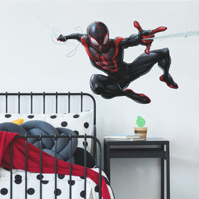 RoomMates Spider-Man Miles Morales decal application demonstrates quick peel-and-stick setup on smooth surfaces