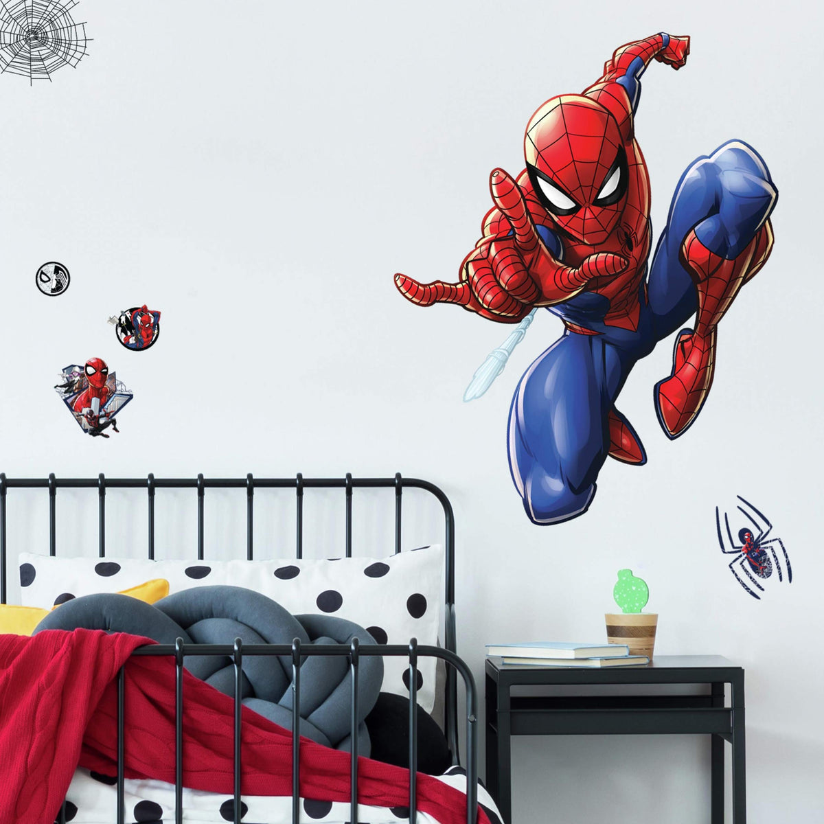 RoomMates Spider-Man decals adhere to smooth surfaces on clean, flat walls