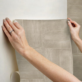 RoomMates taupe wallpaper in a room setting shows versatile styling options.