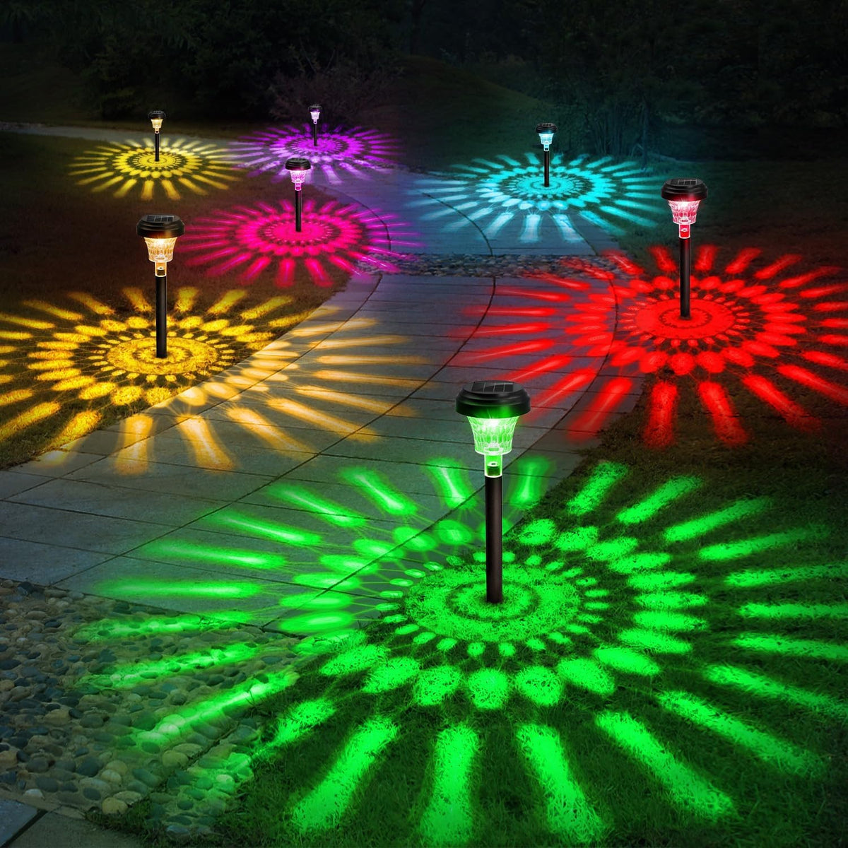ROOR solar pathway light with petal pattern projecting decorative light along a garden path.