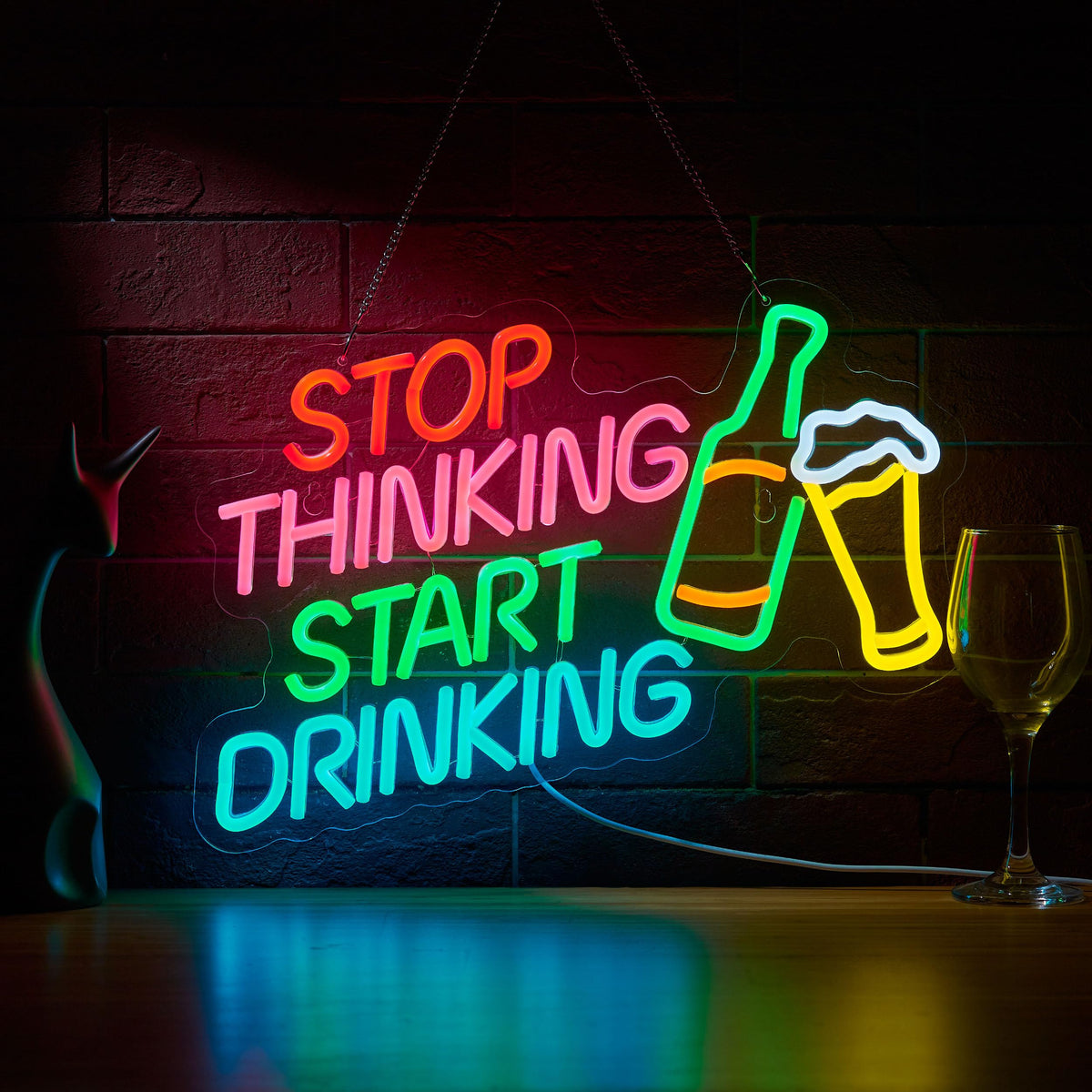 Roouneon stop thinking start drinking bar neon sign adds casual bar ambiance.