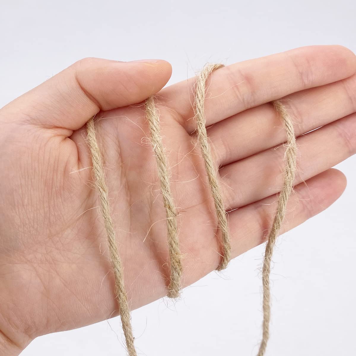 Rophomor jute twine gift-packaging adds rustic texture to presents.