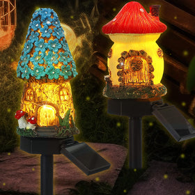 Rossesay Fairy House Mushroom Solar Light lights the garden path at night.