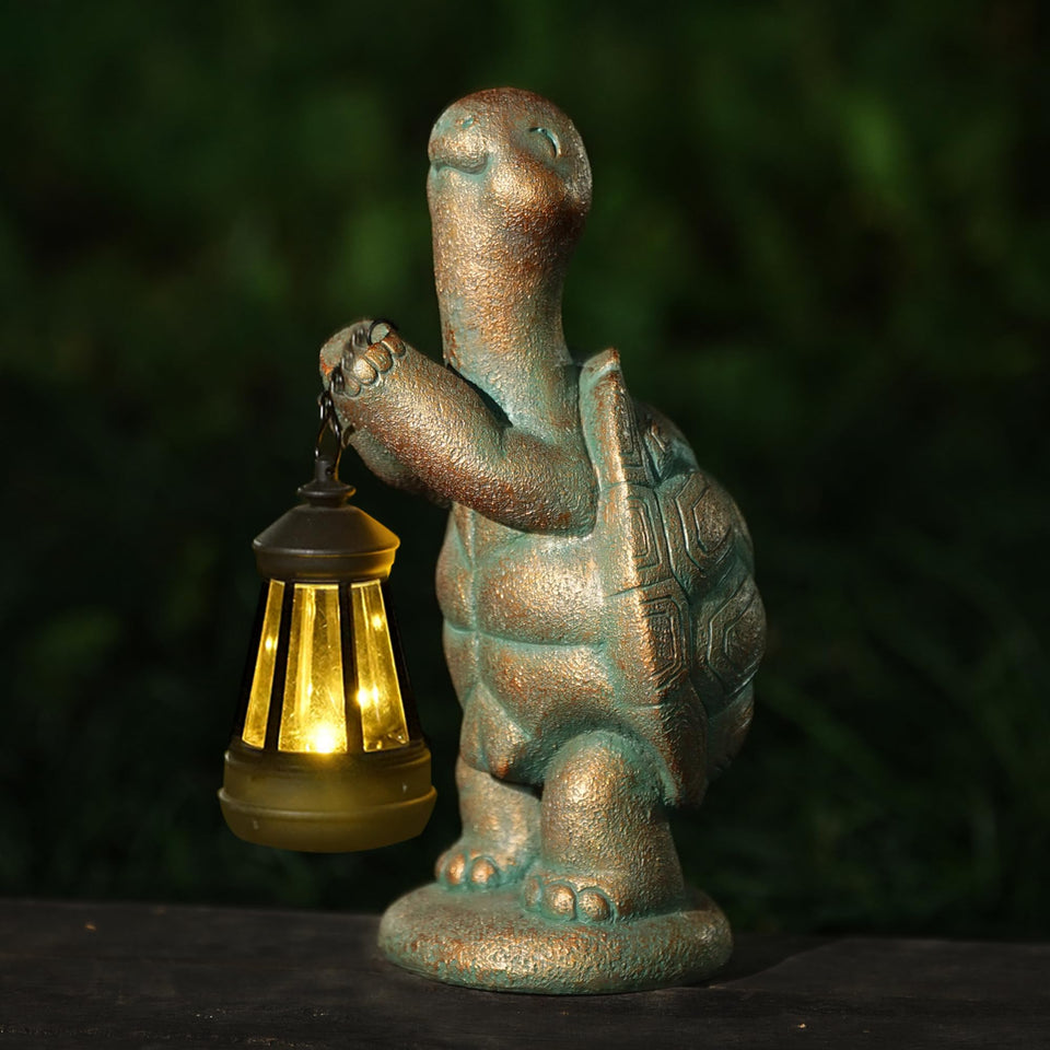 Roundot turtle solar statue glowing at dusk for welcoming garden ambiance.