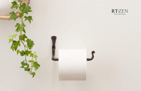 RTZEN wall-mounted toilet paper holder in use beside the sink for easy reach.