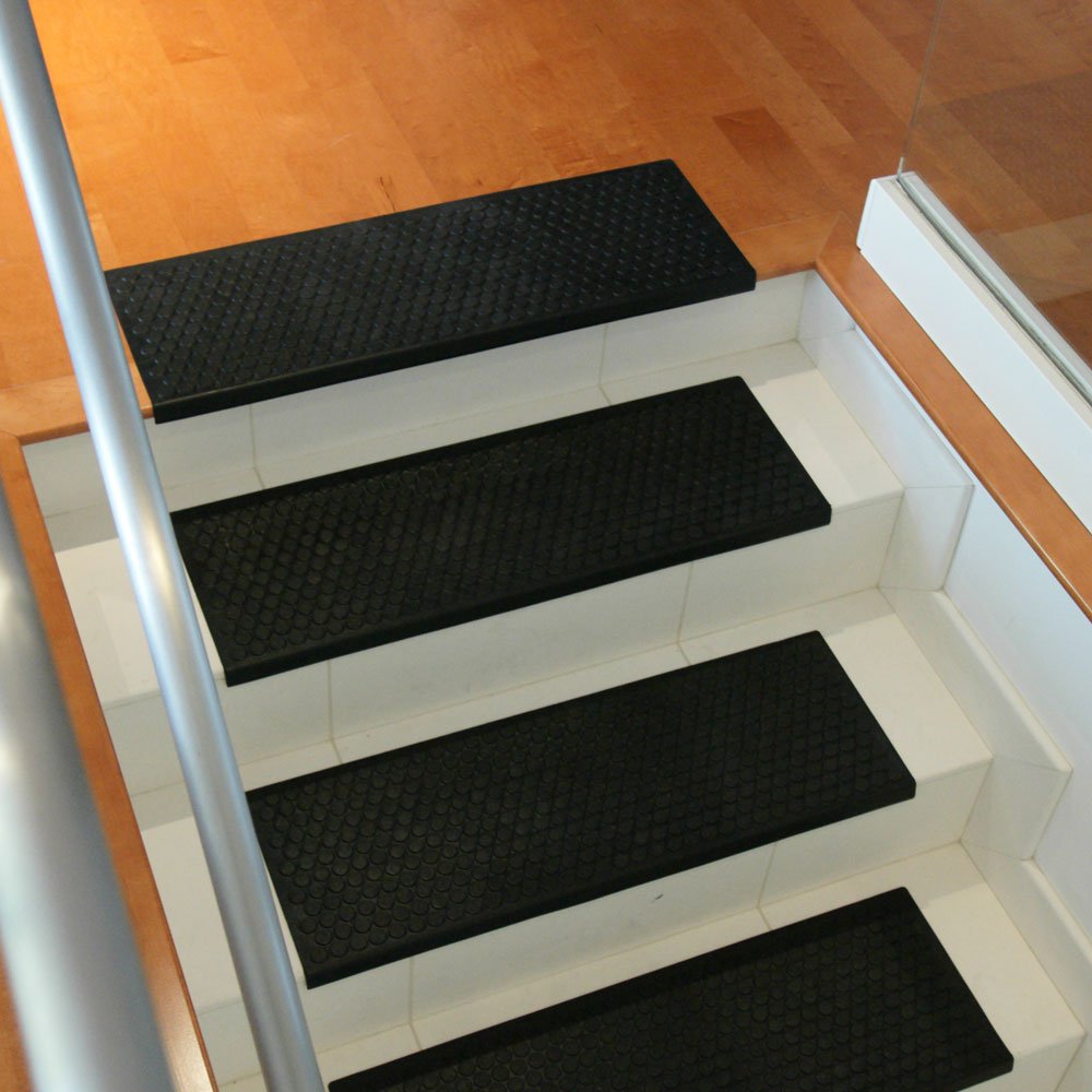 Loose-laid installation using double-sided tape for Rubber-Cal Coin-Grip mats