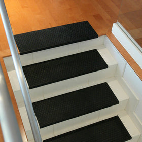 Loose-laid installation using double-sided tape for Rubber-Cal Coin-Grip mats