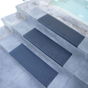 Rubber-Cal Coin-Grip resists sun, rain, and snow on outdoor stairs