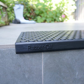 Sleek black Rubber-Cal Coin-Grip mats add safety and style
