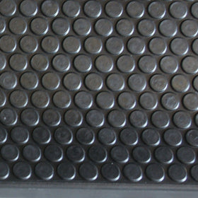 Six-pack Rubber-Cal Coin-Grip mats laid across a staircase