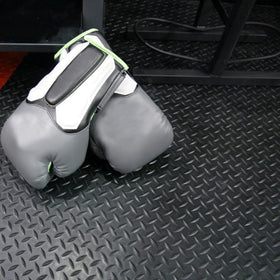 Diamond-Plate garage floor covering by Rubber-Cal reduces wear and damage.