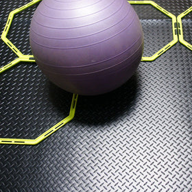 Diamond-Plate gym mat from Rubber-Cal for industrial or home fitness areas.