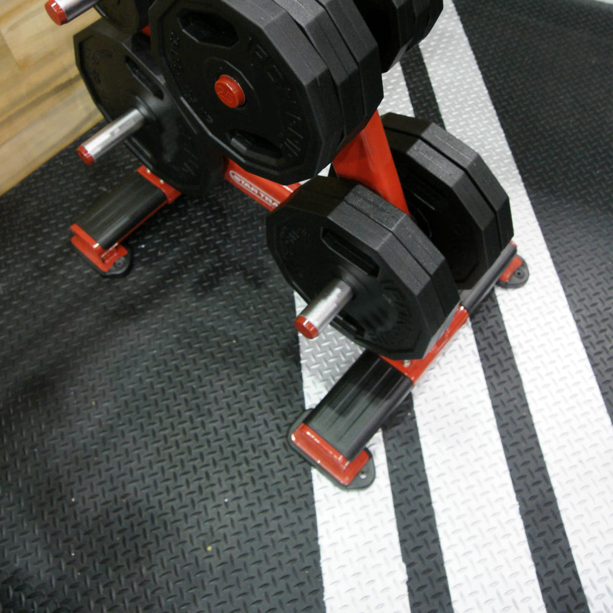 Diamond-Plate walkway mat from Rubber-Cal provides grip on wet outdoor surfaces.