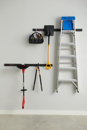 Rubbermaid FastTrack ladder hook keeping a ladder organized and within reach