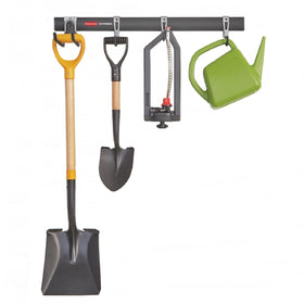 Rubbermaid FastTrack rail mounted on studs for sturdy garage organization
