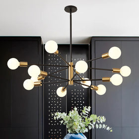 RUIYEY sputnik chandelier in gold and black enhances dining room ambiance with 12 lights.