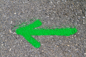 Rust-Oleum fluorescent green exterior marking paint on grass and gravel