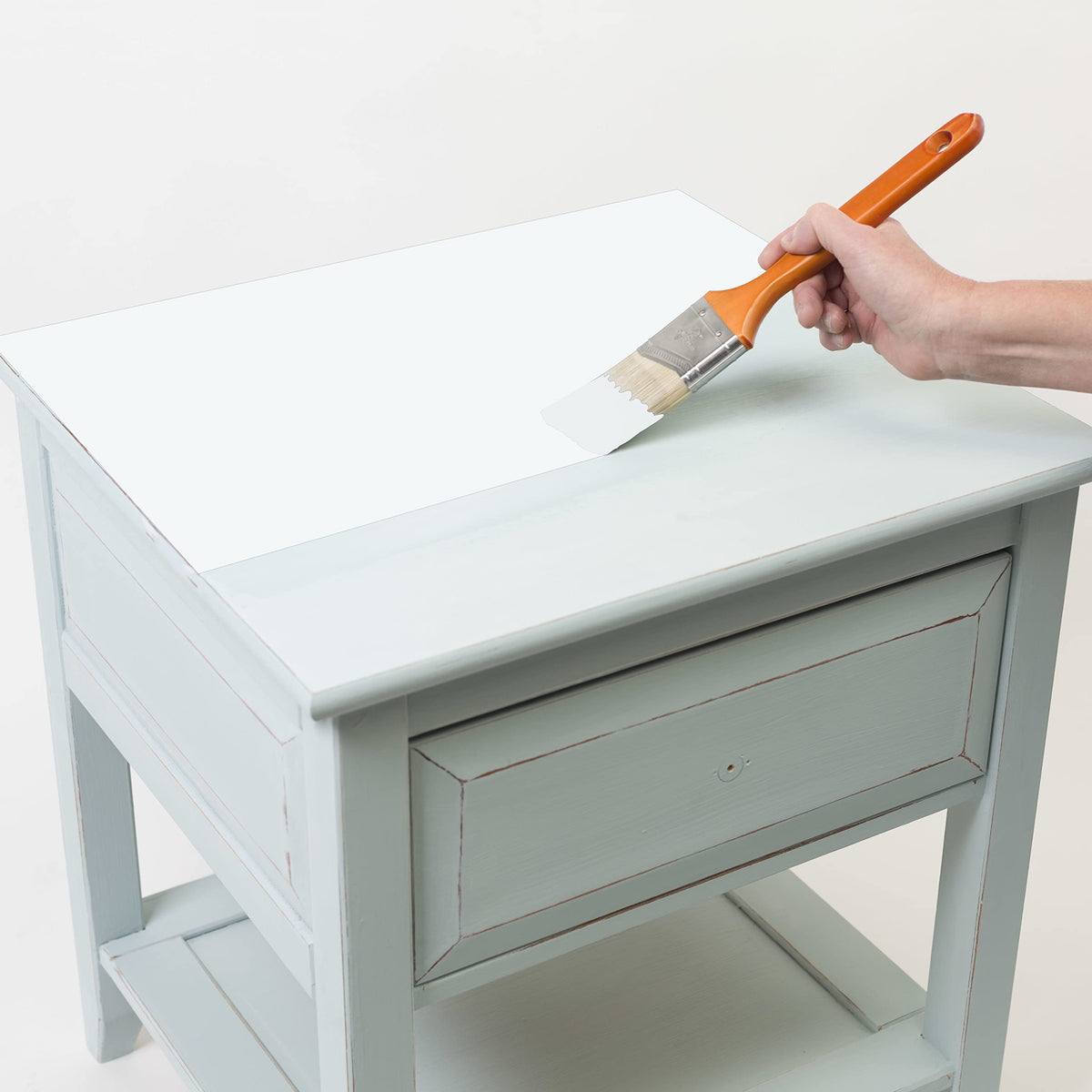 Rust-Oleum adheres to wood, metal, ceramic, and canvas surfaces