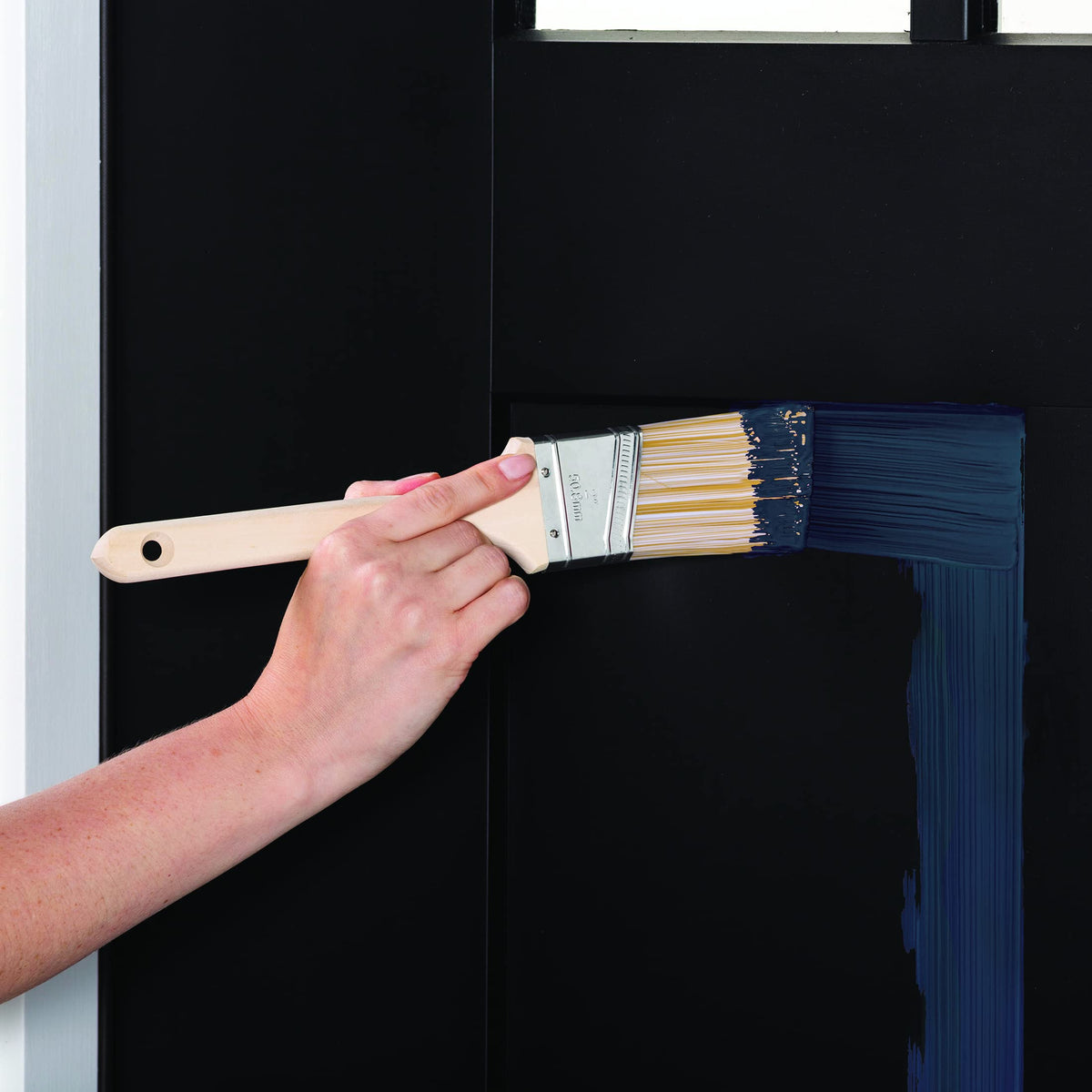 Brush-stroke application with Rust-Oleum Advanced Dry Door & Trim Nantucket Navy for smooth coverage