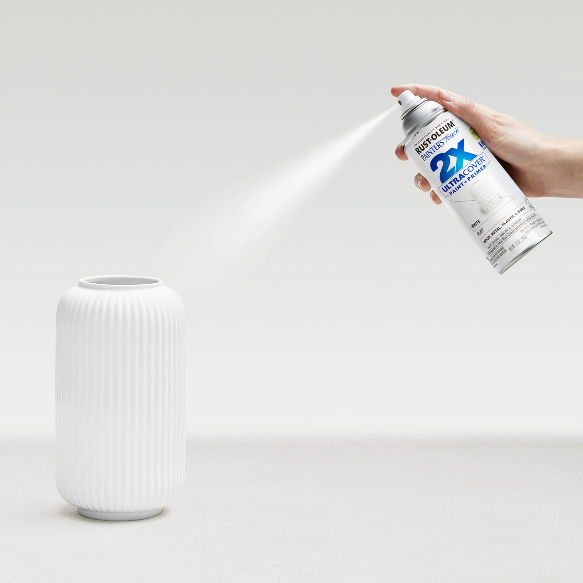 Rust-Oleum Painter's Touch 2X Flat White any-angle spray demonstrates flexibility.