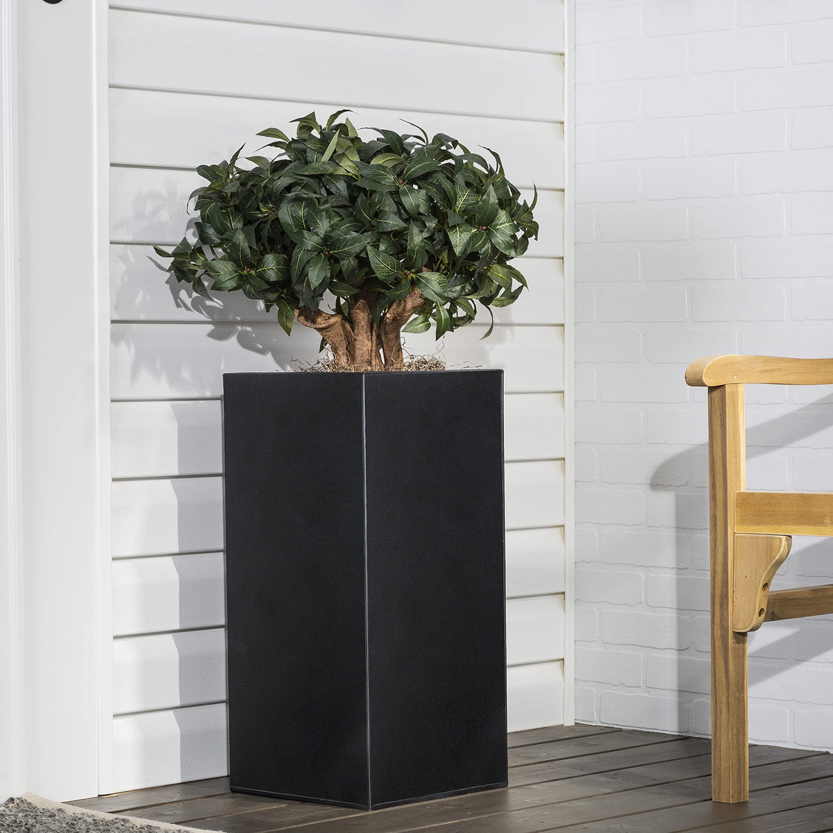 Rust-Oleum Stops Rust textured paint applied upside down for hard-to-reach spots in black.