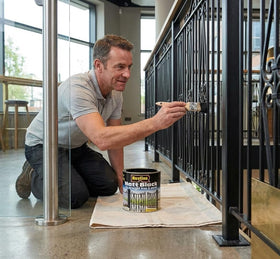Exterior wrought iron surface treated with Rustins Matt Black Paint for durable protection