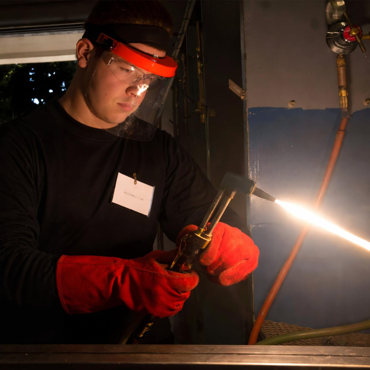 RX WELD heat-resistant base shields the torch during use.
