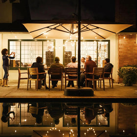 Indoor-outdoor versatility supports trees, railings, and outdoor dining spaces.