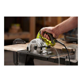RYOBI 12-Amp Wet Tile Saw in use cutting ceramic tile