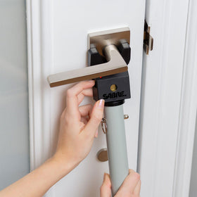 SABRE door security bar alarm activated at 115 dB to deter outsiders.