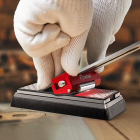 Saker honing guide in use with sharpening stones showing uniform edge results