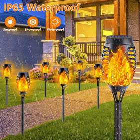 SANJICHA solar torch lights illuminate a garden path with flickering flame.