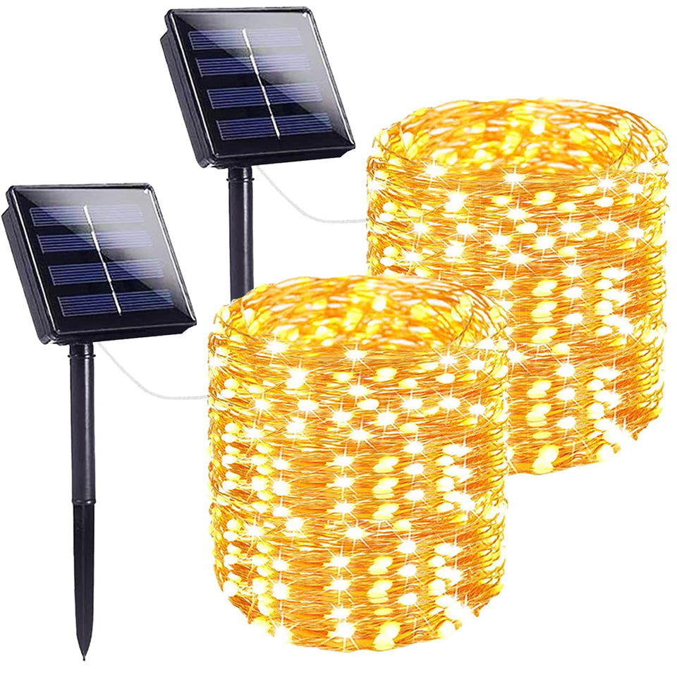 SANJICHA two-pack 72ft solar string lights illuminate trees with a warm glow.