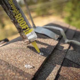 Sashco Quart Clear Roof Sealant adheres to patches on roof surfaces