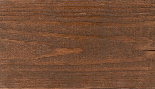 SaverSystems fence dark walnut stain highlights grain on weathered wood.