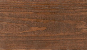 SaverSystems fence dark walnut stain highlights grain on weathered wood.