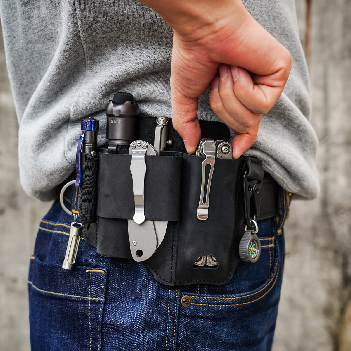 Sayram ST1 leather multitool sheath with flashlight pocket for fast retrieval.