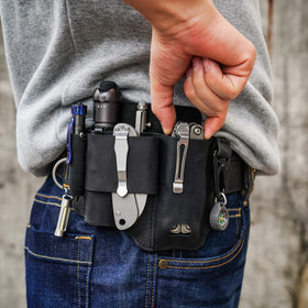 Sayram ST1 leather multitool sheath with flashlight pocket for fast retrieval.