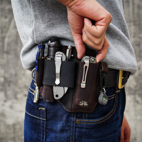 Sayram ST1 leather multitool sheath side view highlights slim profile on a belt.