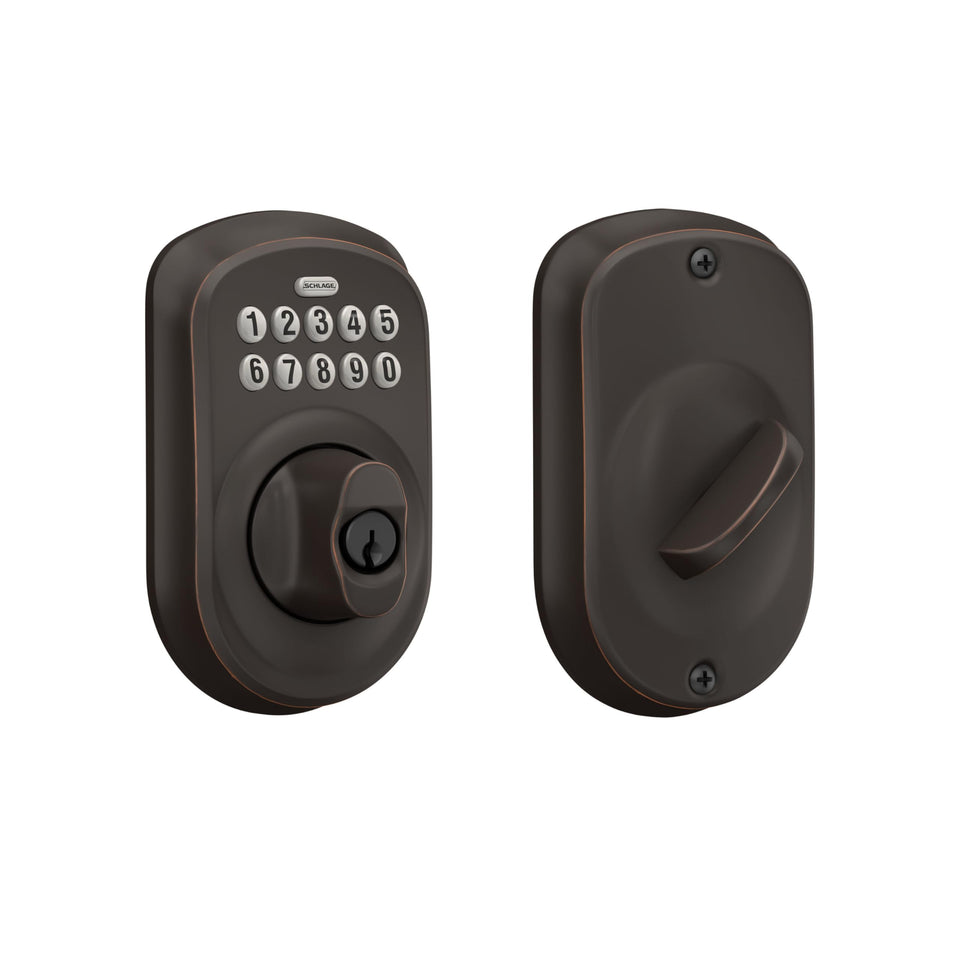 Schlage BE365 Plymouth keypad deadbolt on front door with illuminated keypad for night entry.