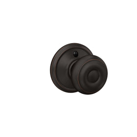 Schlage F10 GEO 716 close-up aged-bronze finish reveals durable hardware.